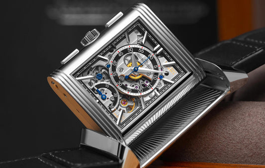  detailed close-up of a vintage Jaeger-LeCoultre Reverso watch, highlighting its iconic Art Deco rectangular case and the fine craftsmanship that defines the 'watchmaker's watchmaker'.